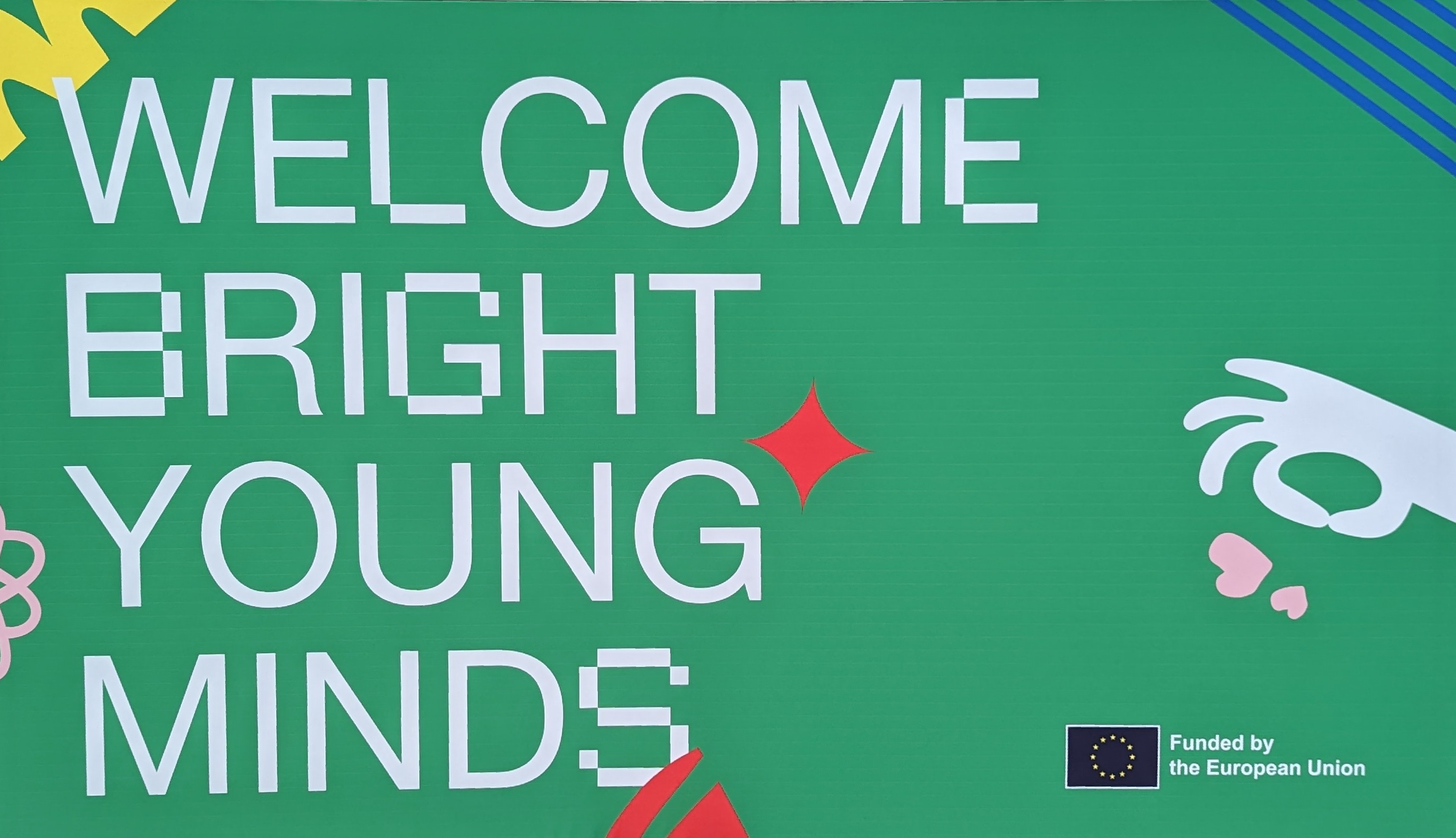 "Welcome Bright Young Minds" is printed on a green background