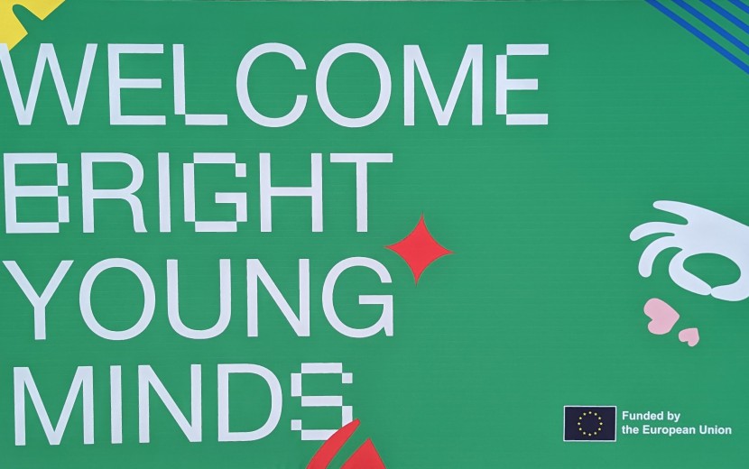"Welcome Bright Young Minds" is printed on a green background